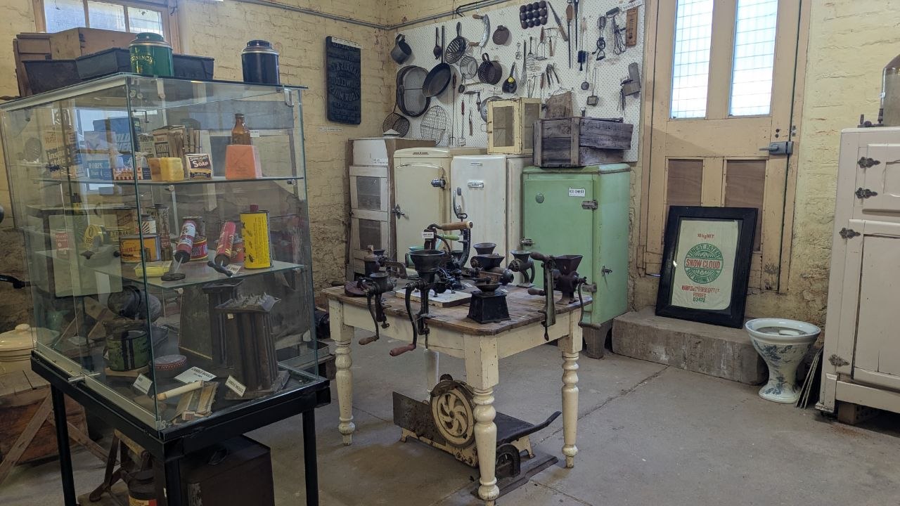The museum kitchen display: vintage stoves, coffee grinders, tins and kitchen implements